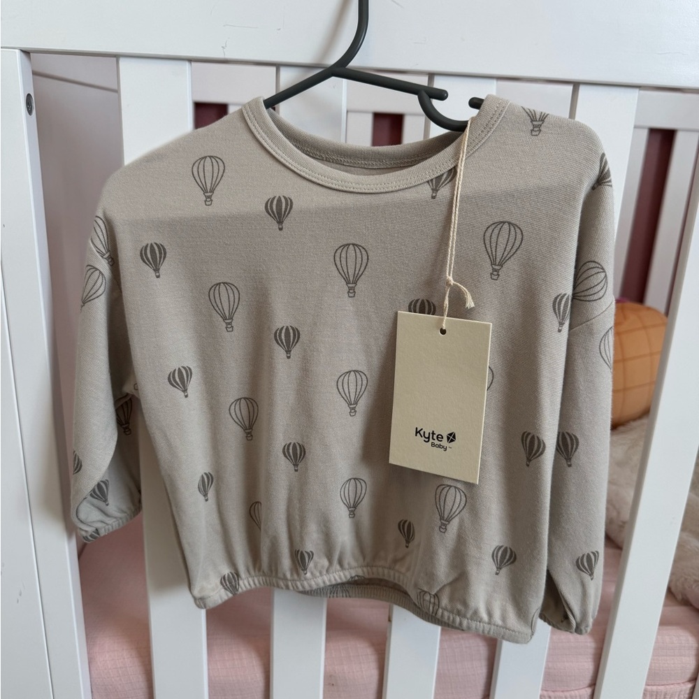 Kyte Baby Balloon drop shoulder top.